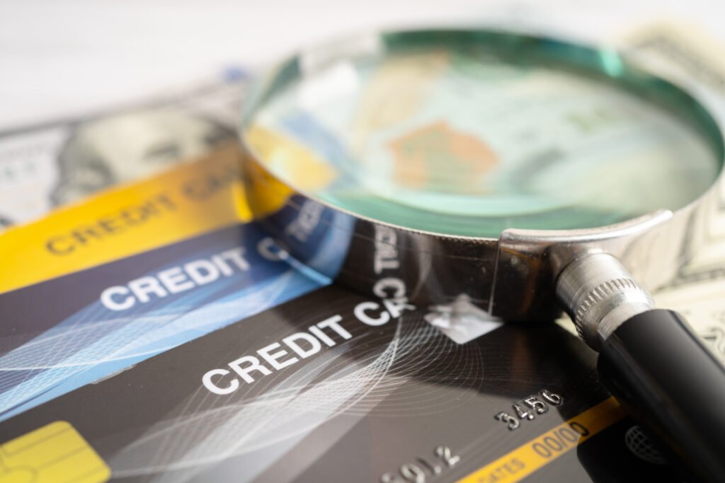 Credit card and US dollar banknotes money, finance concept.